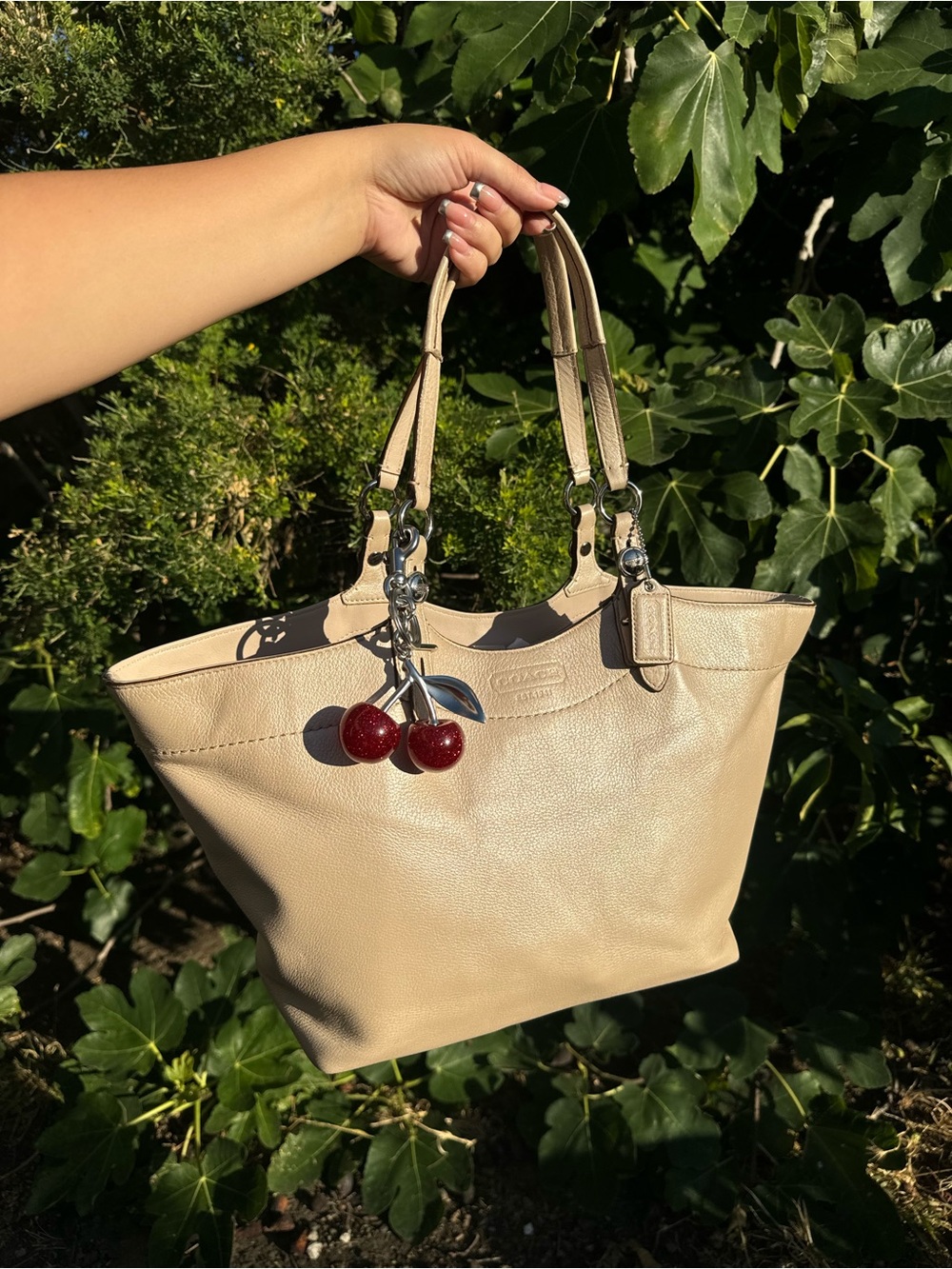 Coach Carly tote in pearlescent cream leather